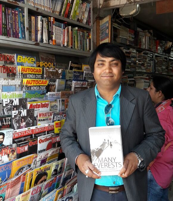 A book lover after buying “Many Everests” in Dehradun …!